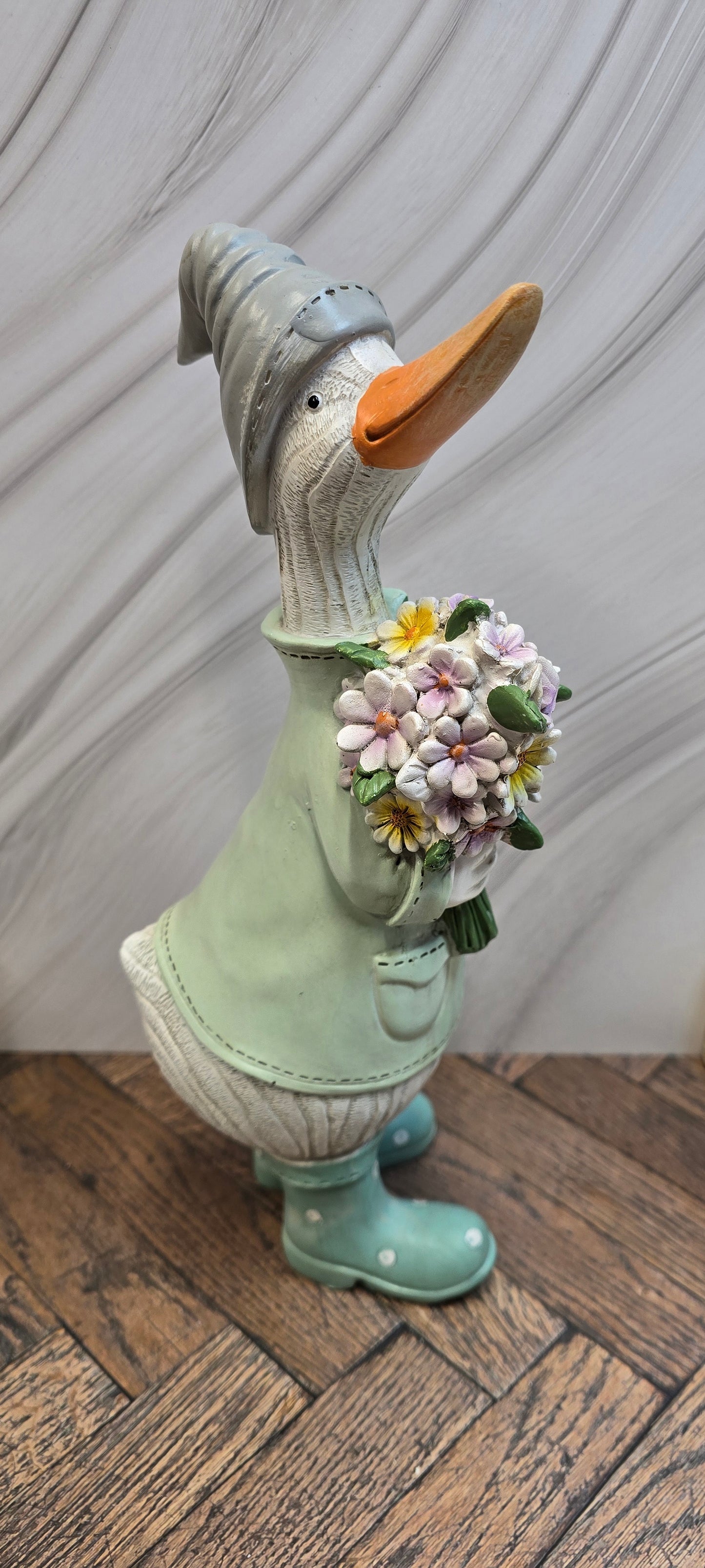 Standing Green Coat Duck with Flower Bouquet
