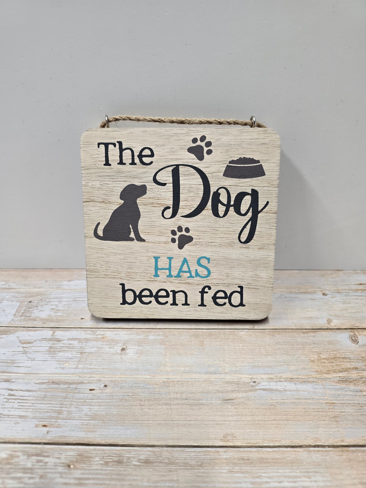 Dog "HAS" or "HASN'T" been fed wood plaque
