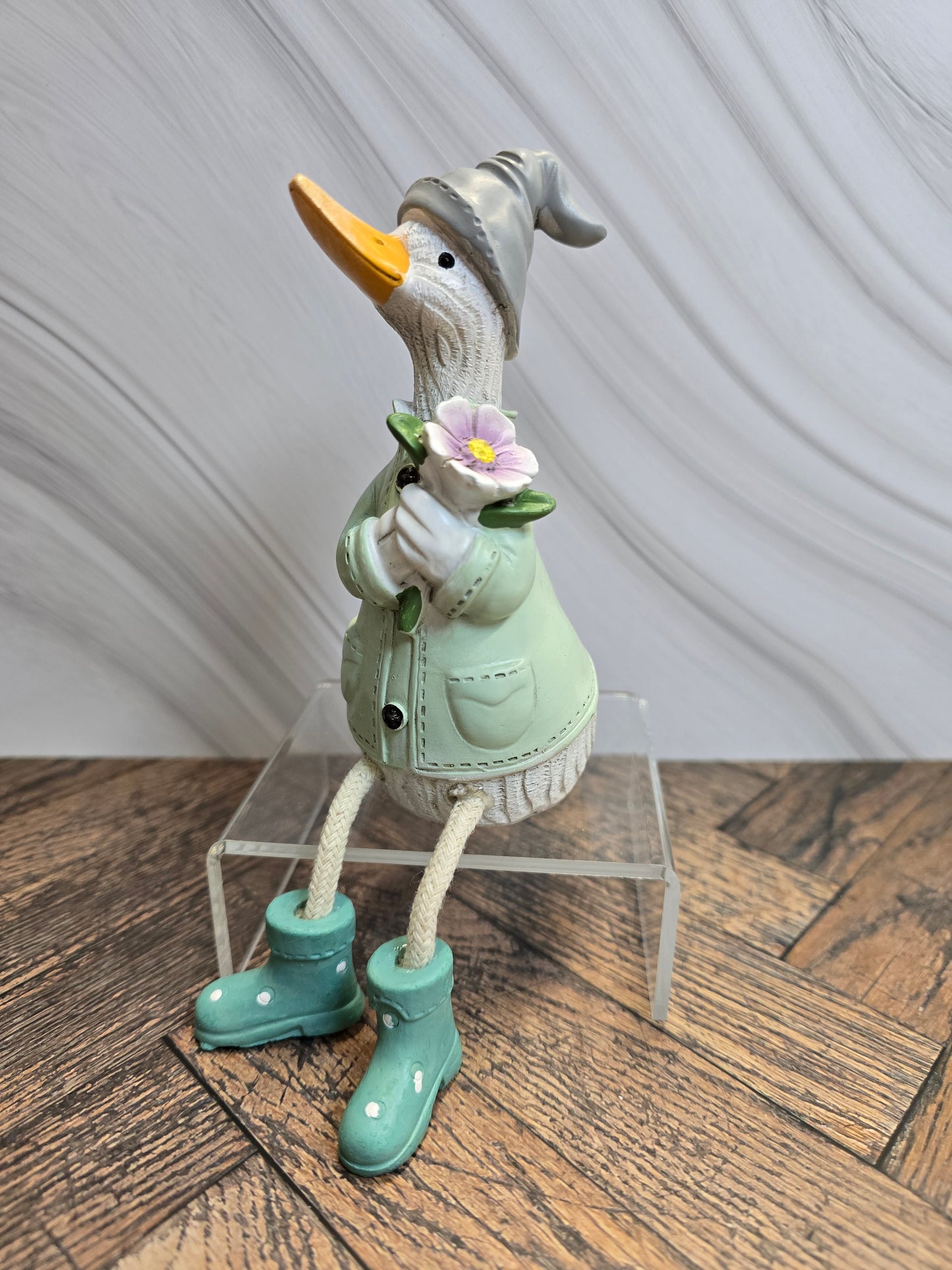 Sitting Duck with floral bouquet
