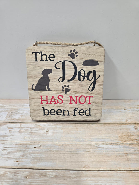Dog "HAS" or "HASN'T" been fed wood plaque