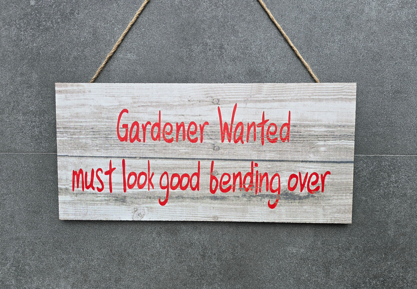 "Gardener wanted must look good bending over" hanging wooden sign
