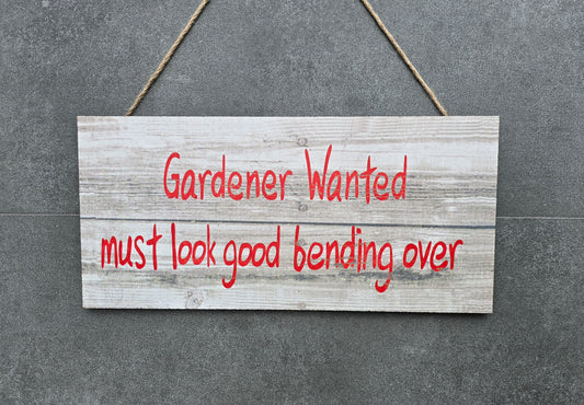 "Gardener wanted must look good bending over" hanging wooden sign