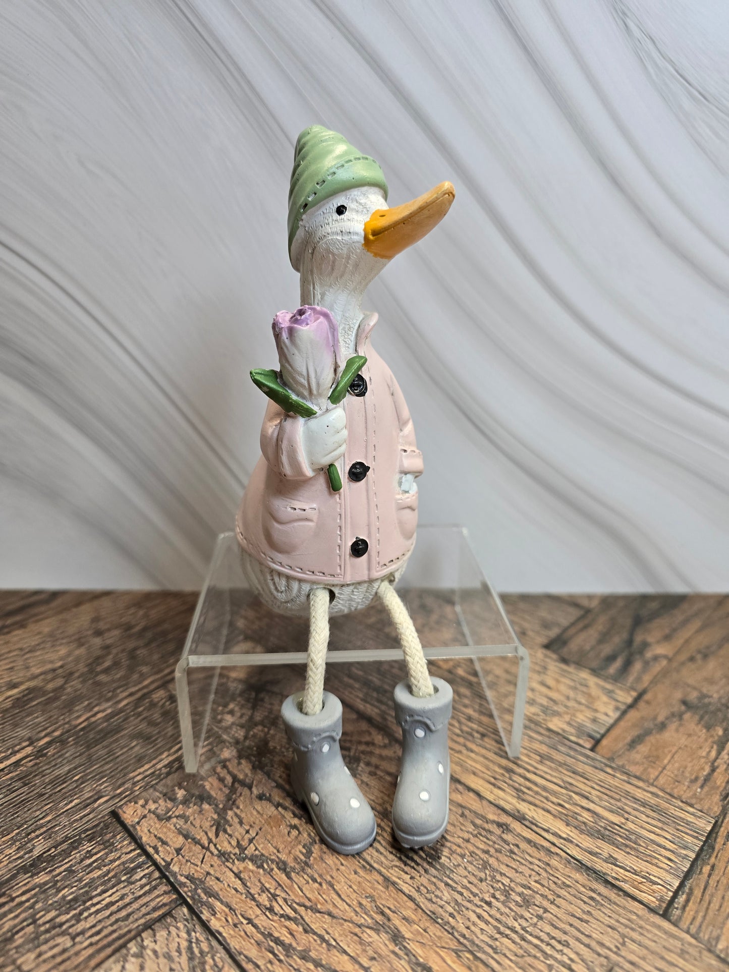 Sitting Duck with floral bouquet